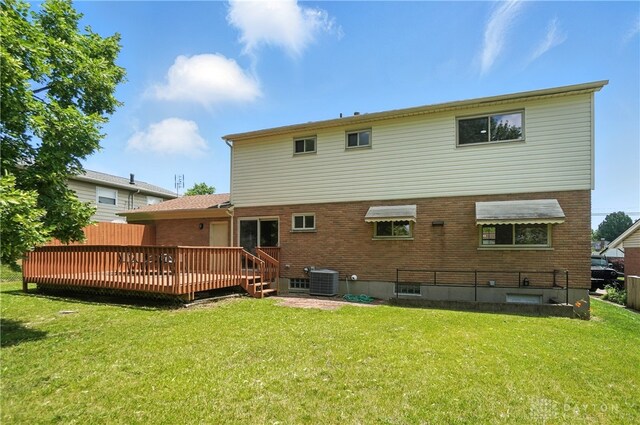 1023 Hilliard Dr, Delhi Twp, OH 45238 - rear view of house with a yard, a wooden deck, and brick siding