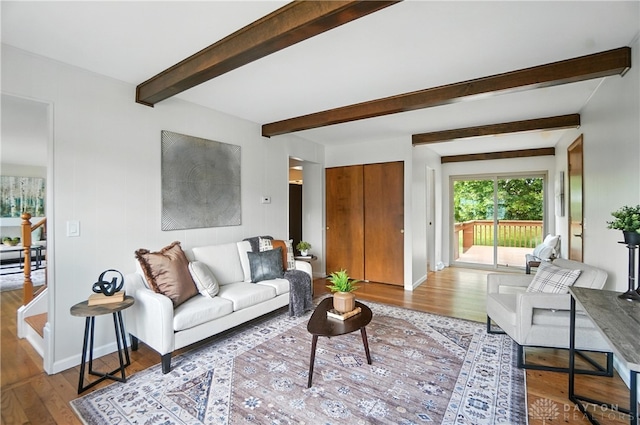 1023 Hilliard Dr, Delhi Twp, OH 45238 - living room with wood finished floors and beamed ceiling