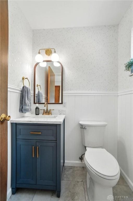 1023 Hilliard Dr, Delhi Twp, OH 45238 - half bathroom with a wainscoted wall, vanity, and tile patterned floors