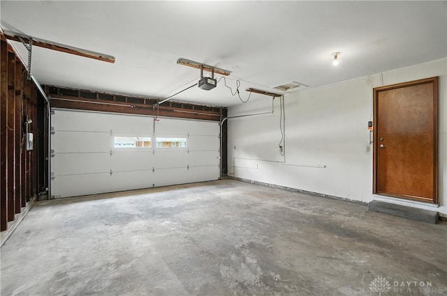 1023 Hilliard Dr, Delhi Twp, OH 45238 - garage featuring a garage door opener