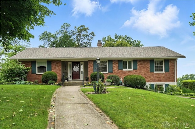 1804 Schirm Dr, Middletown, OH 45042 - ranch-style home featuring brick siding, a chimney, and a front lawn