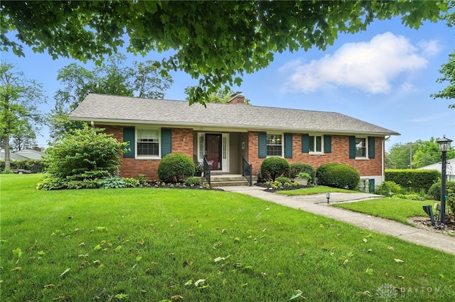 1804 Schirm Dr, Middletown, OH 45042 - ranch-style home featuring brick siding, a front lawn, and a chimney