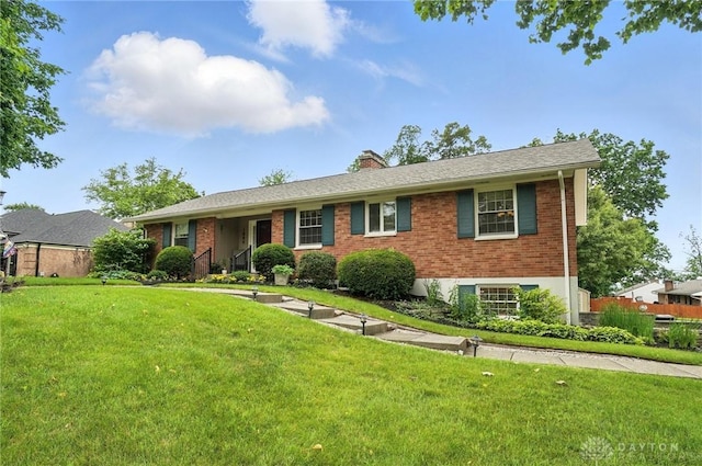 1804 Schirm Dr, Middletown, OH 45042 - ranch-style home with brick siding, a front yard, and a chimney