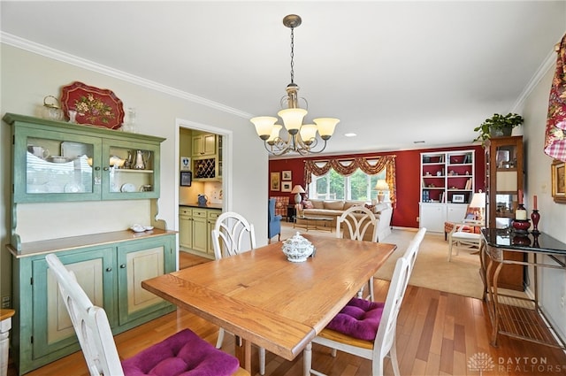 1804 Schirm Dr, Middletown, OH 45042 - dining room with crown molding, a chandelier, and light wood-style floors