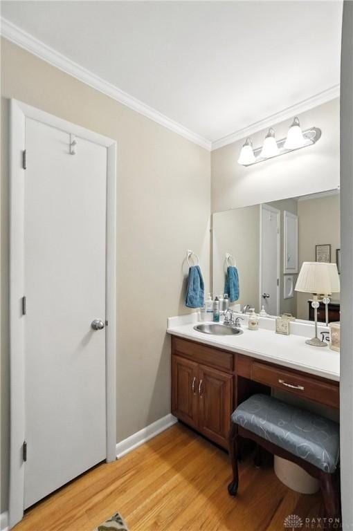 1804 Schirm Dr, Middletown, OH 45042 - bathroom with crown molding, wood finished floors, and vanity