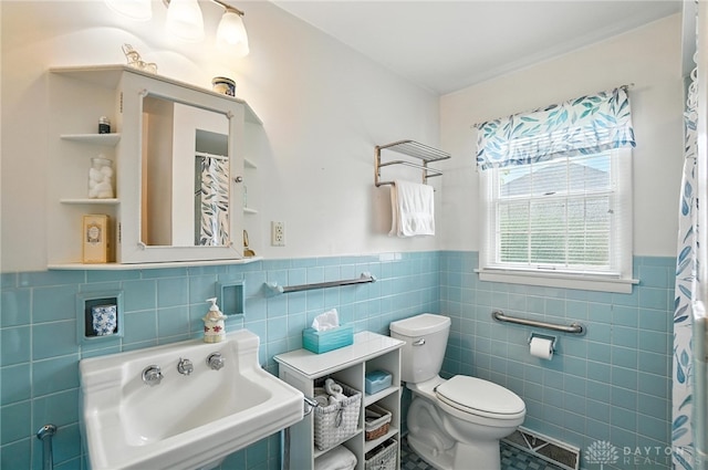 1804 Schirm Dr, Middletown, OH 45042 - full bath with tile walls, wainscoting, and tile patterned floors
