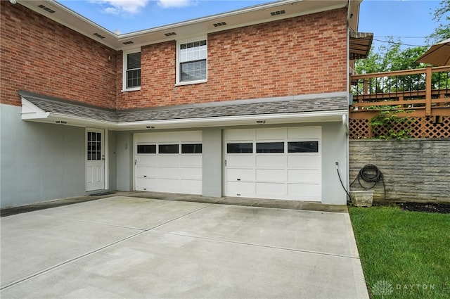 1804 Schirm Dr, Middletown, OH 45042 - view of side of property with an attached garage, driveway, and stucco siding