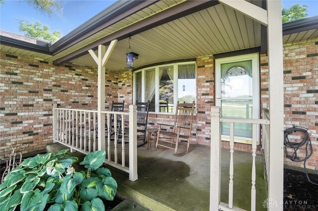 8425 Dillman Rd, Camden, OH 45311 - view of exterior entry featuring a porch and brick siding