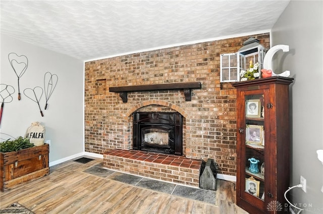 8425 Dillman Rd, Camden, OH 45311 - living area featuring wood finished floors and a textured ceiling