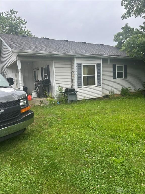 3832 E Lower Springboro Rd, Waynesville, OH 45068 - view of front of home featuring a front lawn and roof with shingles