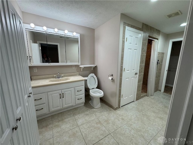 523 Newport Rd, Xenia, OH 45385 - full bathroom featuring vanity, tile patterned floors, a closet, a textured ceiling, and curtained shower