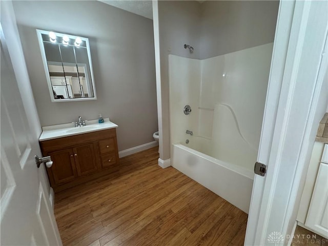 523 Newport Rd, Xenia, OH 45385 - bathroom with vanity, wood finished floors, and tub / shower combination