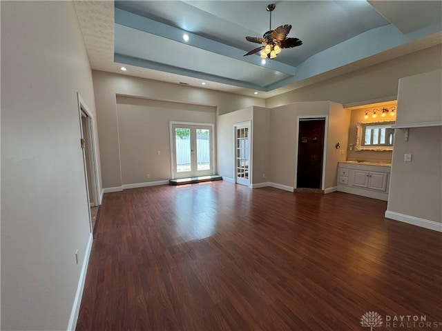 523 Newport Rd, Xenia, OH 45385 - unfurnished living room with dark wood-style floors, french doors, a ceiling fan, and recessed lighting