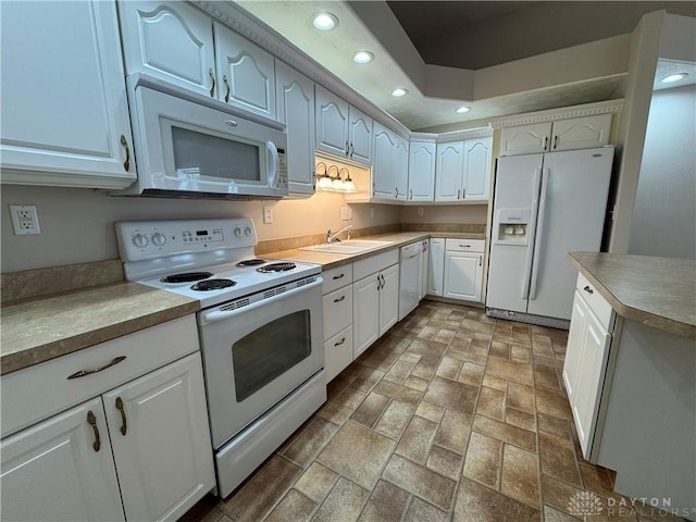 523 Newport Rd, Xenia, OH 45385 - kitchen with white appliances, recessed lighting, white cabinetry, and light countertops