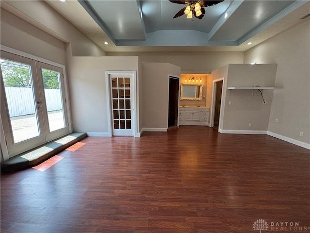 523 Newport Rd, Xenia, OH 45385 - unfurnished living room featuring french doors, a ceiling fan, dark wood finished floors, recessed lighting, and a tray ceiling