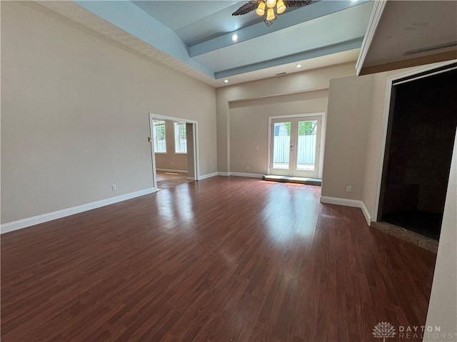 523 Newport Rd, Xenia, OH 45385 - unfurnished living room featuring healthy amount of natural light, beam ceiling, dark wood-style flooring, ceiling fan, and recessed lighting
