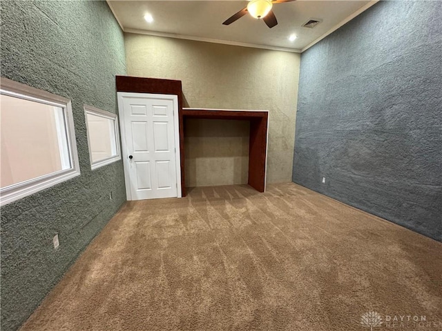 523 Newport Rd, Xenia, OH 45385 - carpeted empty room featuring a ceiling fan, ornamental molding, a textured wall, and recessed lighting