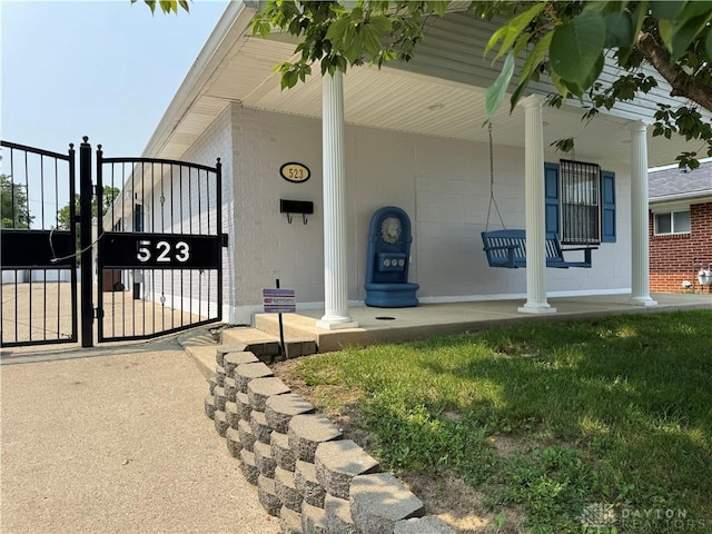 523 Newport Rd, Xenia, OH 45385 - view of exterior entry featuring a porch and a gate