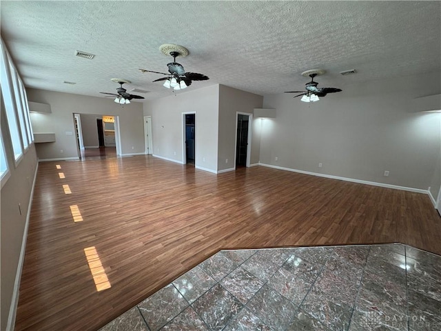 523 Newport Rd, Xenia, OH 45385 - unfurnished living room with ceiling fan, a textured ceiling, and wood finished floors