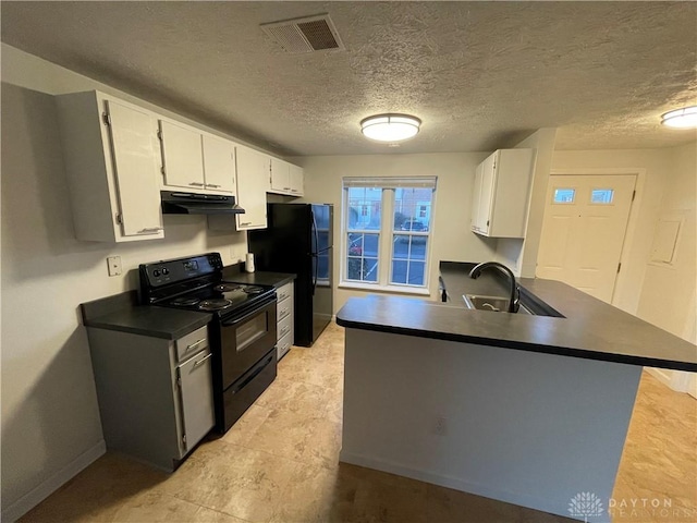 2133 Chapel Dr, Fairborn, OH 45324 - kitchen with black appliances, dark countertops, under cabinet range hood, a peninsula, and white cabinetry