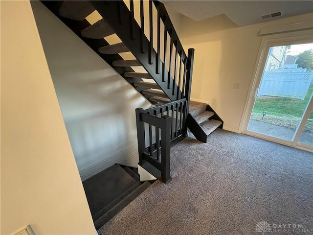 2133 Chapel Dr, Fairborn, OH 45324 - staircase featuring carpet floors and baseboards