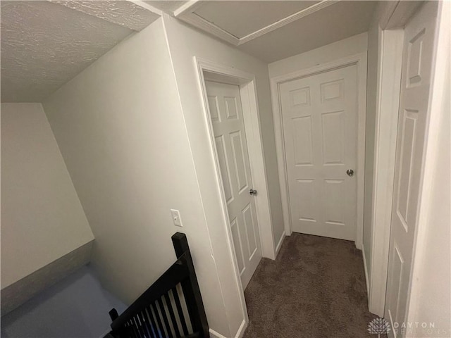 2133 Chapel Dr, Fairborn, OH 45324 - hall featuring dark colored carpet, an upstairs landing, and a textured ceiling