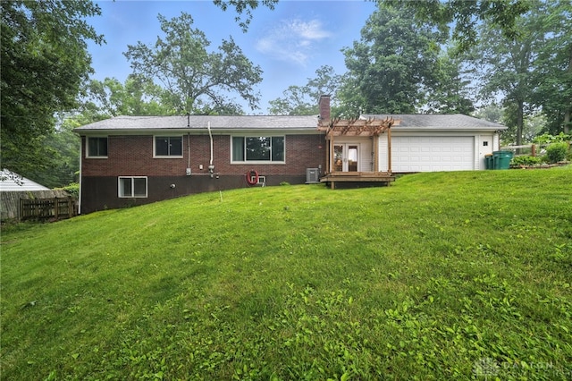 945 Oakland Dr, Beavercreek Twp, OH 45434 - back of property featuring a garage, a chimney, and brick siding