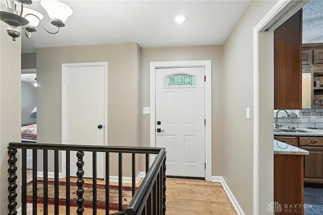 945 Oakland Dr, Beavercreek Twp, OH 45434 - foyer featuring light wood-type flooring, a chandelier, and recessed lighting