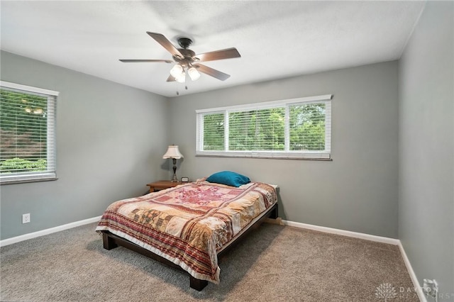 945 Oakland Dr, Beavercreek Twp, OH 45434 - carpeted bedroom with baseboards and a ceiling fan