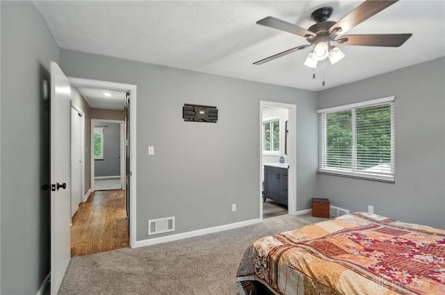 945 Oakland Dr, Beavercreek Twp, OH 45434 - bedroom featuring carpet floors, ensuite bath, and a ceiling fan