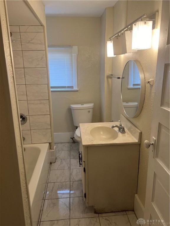 208 Heaton Ave, Dayton, OH 45410 - full bathroom featuring marble look tile flooring, vanity, and bathing tub / shower combination