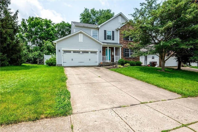 2858 Willow Ridge Dr, Colerain Twp, OH 45251 - traditional-style house with driveway, a front yard, a garage, a porch, and brick siding
