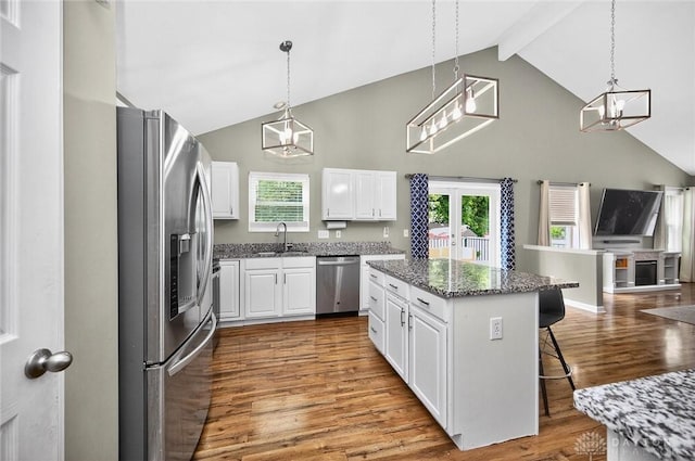 2858 Willow Ridge Dr, Colerain Twp, OH 45251 - kitchen featuring stainless steel appliances, high vaulted ceiling, wood finished floors, a chandelier, and white cabinetry