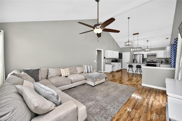 2858 Willow Ridge Dr, Colerain Twp, OH 45251 - living room with a ceiling fan, high vaulted ceiling, and dark wood-style floors
