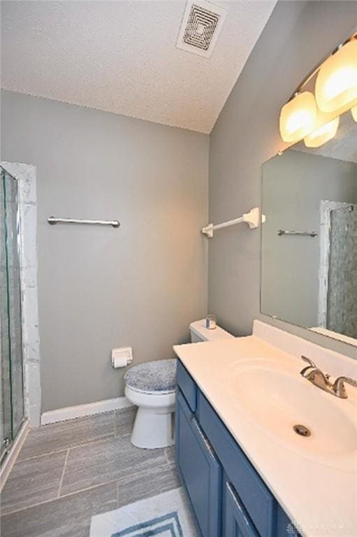 2858 Willow Ridge Dr, Colerain Twp, OH 45251 - full bathroom featuring a shower stall, vanity, and a textured ceiling