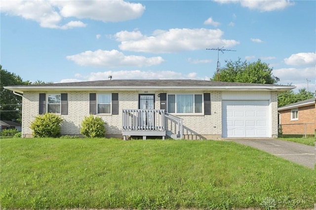 1513 Arrowhead Trl, Xenia, OH 45385 - single story home featuring a garage, driveway, a front yard, and brick siding