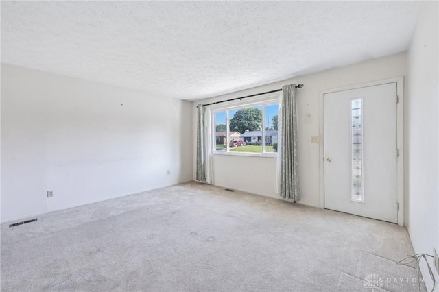 1513 Arrowhead Trl, Xenia, OH 45385 - unfurnished room featuring carpet floors and a textured ceiling
