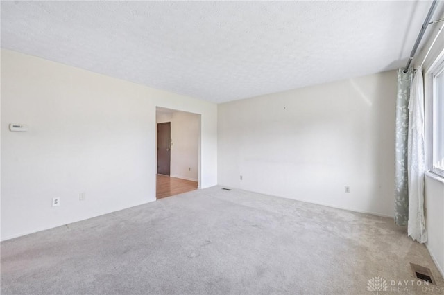 1513 Arrowhead Trl, Xenia, OH 45385 - carpeted spare room featuring a textured ceiling