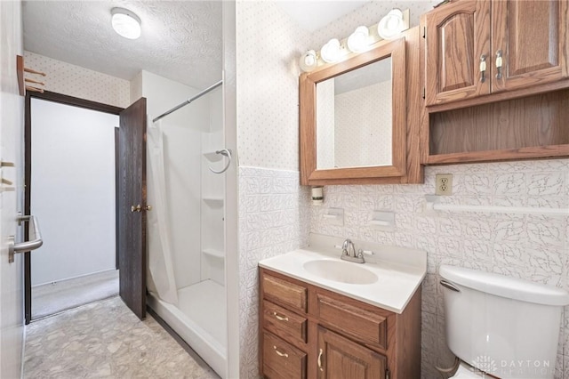 1513 Arrowhead Trl, Xenia, OH 45385 - full bathroom featuring vanity, a shower, wallpapered walls, and a textured ceiling