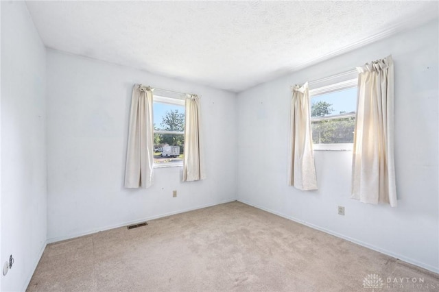 1513 Arrowhead Trl, Xenia, OH 45385 - empty room with plenty of natural light and carpet flooring