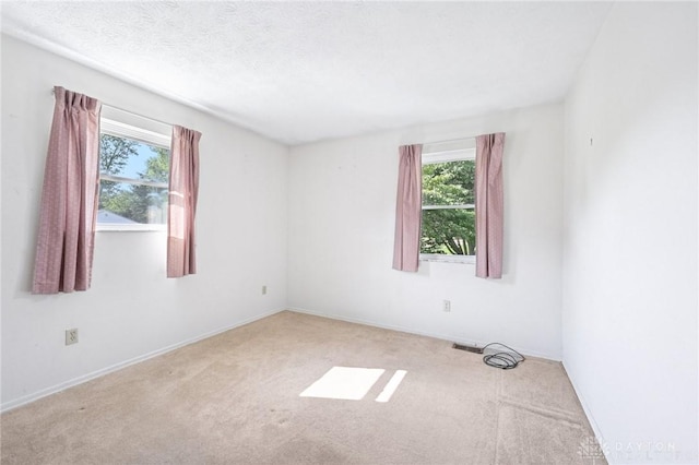 1513 Arrowhead Trl, Xenia, OH 45385 - empty room with plenty of natural light and carpet floors