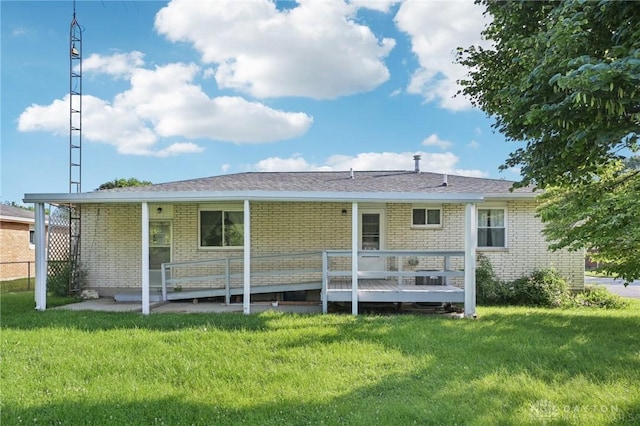1513 Arrowhead Trl, Xenia, OH 45385 - rear view of property featuring a lawn, brick siding, and a wooden deck