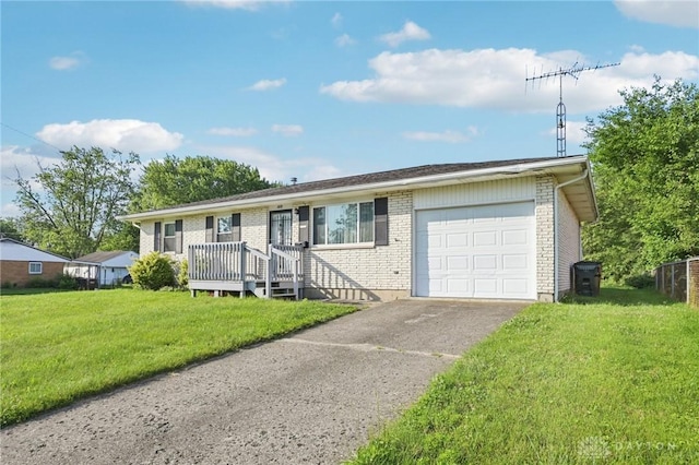 1513 Arrowhead Trl, Xenia, OH 45385 - ranch-style home featuring an attached garage, a front yard, brick siding, and asphalt driveway