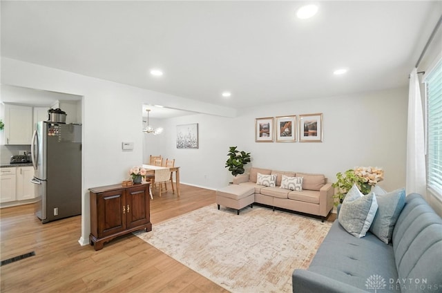 1424 Hillary Ln, Mason, OH 45040 - living room featuring light wood-type flooring, recessed lighting, and a chandelier