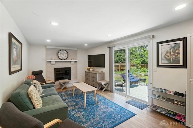 1424 Hillary Ln, Mason, OH 45040 - living room featuring wood finished floors, a fireplace, and recessed lighting