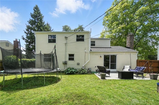1424 Hillary Ln, Mason, OH 45040 - back of property featuring a trampoline, outdoor lounge area, a patio, and a chimney