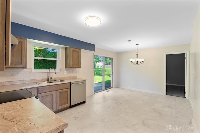 925 Robinette Ave, Vandalia, OH 45377 - kitchen with dishwasher, a chandelier, tasteful backsplash, light countertops, and light marble finish flooring