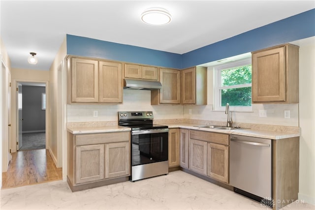 925 Robinette Ave, Vandalia, OH 45377 - kitchen with stainless steel appliances, under cabinet range hood, light marble finish floors, light countertops, and backsplash