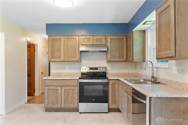 925 Robinette Ave, Vandalia, OH 45377 - kitchen featuring stainless steel appliances, under cabinet range hood, light countertops, and backsplash