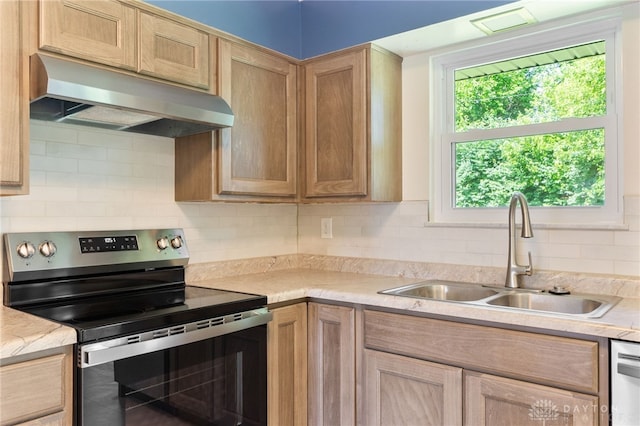 925 Robinette Ave, Vandalia, OH 45377 - kitchen with stainless steel appliances, under cabinet range hood, light countertops, and decorative backsplash